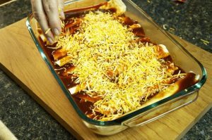 OMG! Melty-gooey Mexican style cheesy enchiladas smothered in a killer homemade red enchilada sauce. Muy delicioso! Makes a very generous dinner for four for under $1.50 per serving!