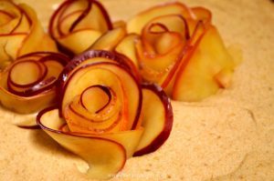 Apple Rose Tart pairs a crunchy, toasted pecan crust with rich apple butter cheesecake covered in roses made from sliced apples. Get your camera ready!