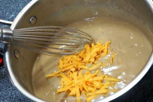 Best Bar snack EVER made easy at home! Irish Nachos with delicious Guinness Cheddar Cheese sauce to top it all! Make it next game day!
