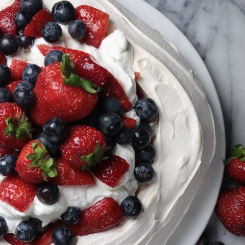 berry filled meringue pavlova dessert