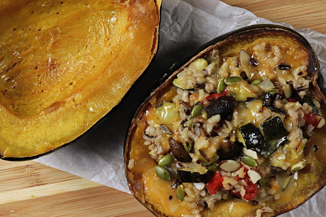 Delicious oven baked acorn squash stuffed with rice, sausage, veggies and melted cheese on top. Divine!