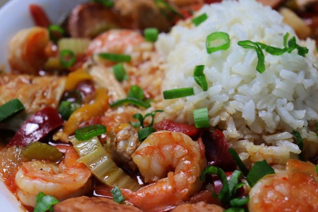 Vibrant jambalaya, with shrimp, chicken and andouie sausage in a spicy stew made with lots onions and peppers. A New Orleans Classic!