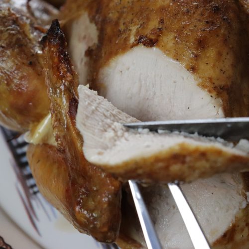 A perfectly roast, juicy, delicious turkey. It's being carved to show how juicy it is.