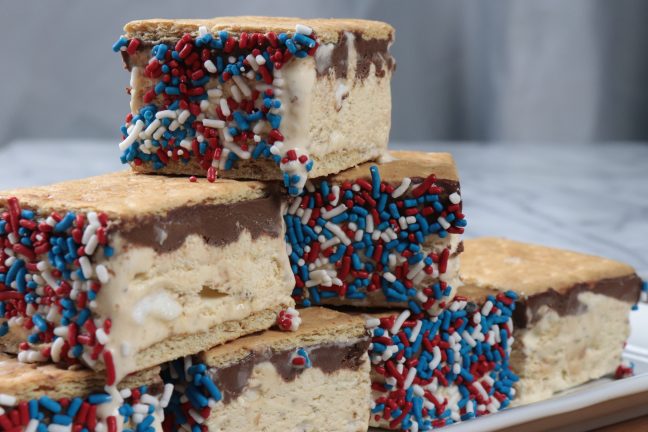 Cool, creamy ice cream sandwiches meet S'mores in this delectable, fun recipe. Perfect for celebrating Independence Day and every day in summer!