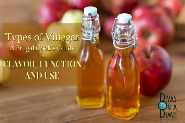 A guide to the most common types of vinegar, what they taste like a d how to use them in cooking and other uses. Picture shows 2 bottles of vinegar on a wood table surrounded by apples suggesting apple cider vinegar. Yum!