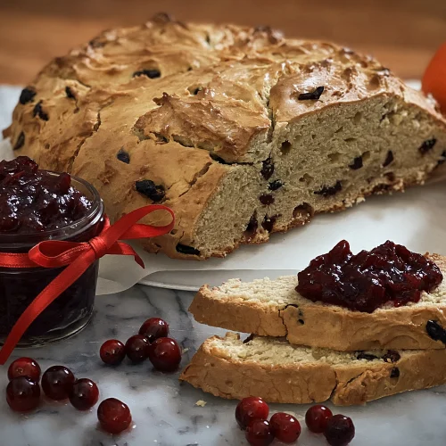 A crusty, buttery twist on Irish soda bread packed with dried cranberries and fresh orange zest.