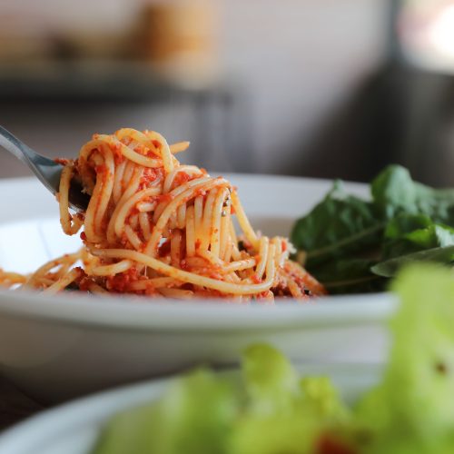 A bowl of spaghetti with a delicious tomato pasta sauce, and you wouldn't know there are white we used sneaky beans to make the sauce creamy.
